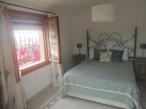 A bed or beds in a room at Ca Olivar