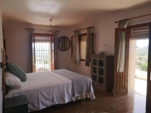 A bed or beds in a room at Ca Olivar