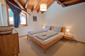 Ένα ή περισσότερα κρεβάτια σε δωμάτιο στο Residence Bellevue, Apartment Alpina