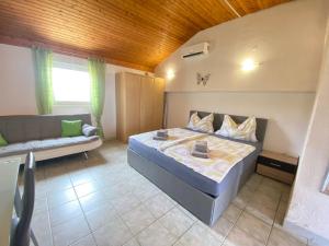 Posteľ alebo postele v izbe v ubytovaní Villa Sabina - Apartments Kroatien