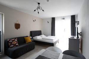 Postel nebo postele na pokoji v ubytování MEDUSA apartamenty i bungalowy