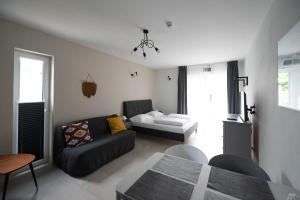 Postel nebo postele na pokoji v ubytování MEDUSA apartamenty i bungalowy