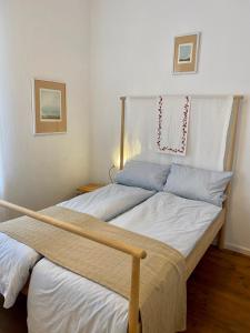 Postel nebo postele na pokoji v ubytování Kläve12 Guesthouse