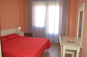 Postel nebo postele na pokoji v ubytování Hotel Torvaianica