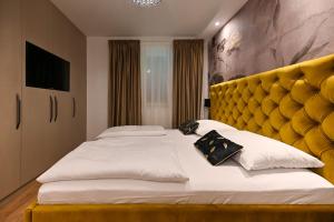 Posteľ alebo postele v izbe v ubytovaní Apartments An & Lu with Rooftop Jacuzzi