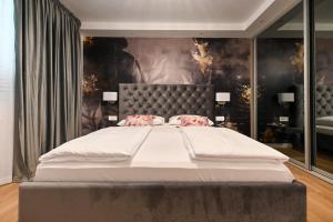 Posteľ alebo postele v izbe v ubytovaní Apartments An & Lu with Rooftop Jacuzzi