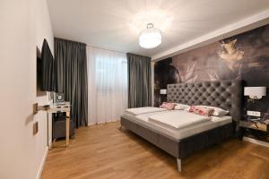 Posteľ alebo postele v izbe v ubytovaní Apartments An & Lu with Rooftop Jacuzzi