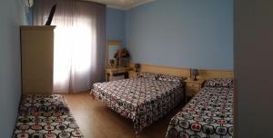 Postel nebo postele na pokoji v ubytování Hotel Torvaianica
