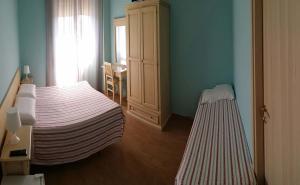 Postel nebo postele na pokoji v ubytování Hotel Torvaianica
