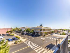 an aerial view of a city street with a building at The Hanford Hotel in Hanford