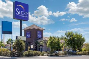 a street sign on the side of a building at Sleep Inn & Suites Bakersfield North in Bakersfield