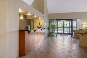 a lobby of a hotel with a bar and a living room at Sleep Inn & Suites Bakersfield North in Bakersfield