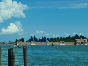 a view of a body of water with a pier at Hotel Vecellio Venice on the Lagoon in Venice