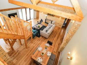 an overhead view of the living room and dining room in a log home at Petals Patch in Cheltenham