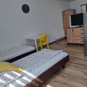 Postel nebo postele na pokoji v ubytování Figaro Apartaments
