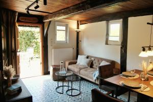 a living room with a couch and a table at Alter Speicher in Soltau