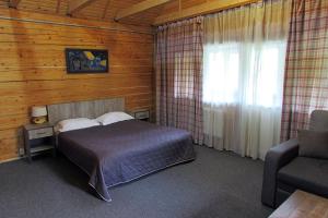 Postel nebo postele na pokoji v ubytování Shale Verba