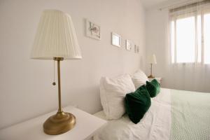 Postel nebo postele na pokoji v ubytování Sweet Home Apartaments