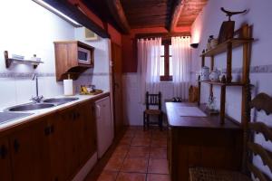 Virtuve vai virtuves zona naktsmītnē Puerto Roque Turismo Rural