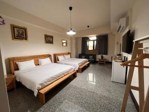 Postel nebo postele na pokoji v ubytování Fish House Homestay