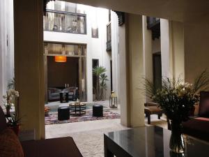 a large living room with a couch and a table at Riad Vanilla Sma & Spa in Marrakesh