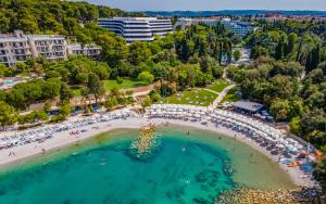 an aerial view of a beach with people in the water at Paradiso Luxury Apartment, Rovinj in Rovinj