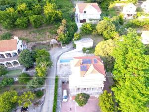an overhead view of a house with a driveway and a road at Vila Ćorović in Kumbor