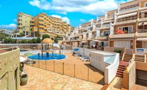 an apartment complex with a pool and a playground at Tenerifeopenhome Costa Adeje comfort apartment 3 pools in Adeje