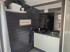 a kitchen with a sink and a counter top at Bulles d'Auvergne 