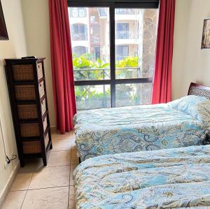 Postel nebo postele na pokoji v ubytování BEACHFRONT Condo Bahia Encantada L1 Jaco Beach