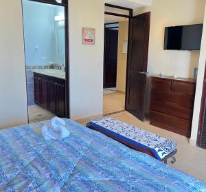 Postel nebo postele na pokoji v ubytování BEACHFRONT Condo Bahia Encantada L1 Jaco Beach
