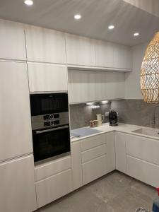 Kuchyňa alebo kuchynka v ubytovaní Appartement Le Palais du Commerce