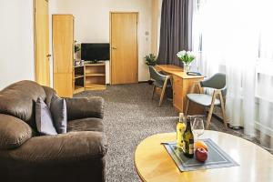 a living room with a couch and a table at Mini-Hotel Kyivskyі in Kyiv