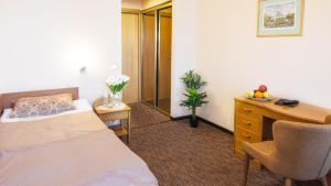 Postel nebo postele na pokoji v ubytování Mini-Hotel Kyivskyі