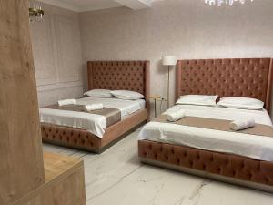 Кровать или кровати в номере Tbili Metekhi Boutique Hotel