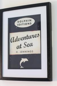 a framed picture of a sign that reads adventurers at sea at Shorebreak - Bracklesham Bay Apartment in Chichester