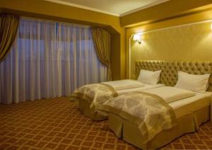 Postel nebo postele na pokoji v ubytování Hotel Bulevard + 6 fotografií