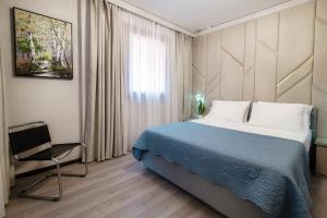 Postel nebo postele na pokoji v ubytování Florissa - by MyHomeInComo