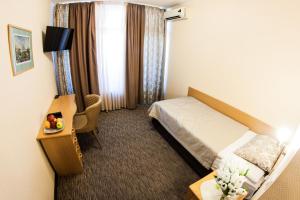 Postel nebo postele na pokoji v ubytování Mini-Hotel Kyivskyі
