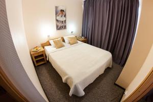 Postel nebo postele na pokoji v ubytování Mini-Hotel Kyivskyі