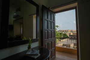 a door leading to a balcony with a view at Tripli Hotels Prithvi Palace in Jaisalmer