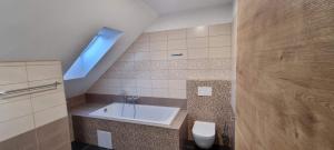 Kúpeľňa v ubytovaní Apartmány Adieu 2