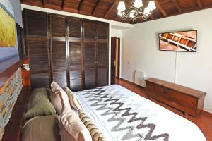 Ένα ή περισσότερα κρεβάτια σε δωμάτιο στο Casa El Roquito +14 φωτογραφίες
