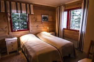 Postel nebo postele na pokoji v ubytování Lomakulkuri Apartments