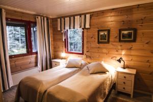 Postel nebo postele na pokoji v ubytování Lomakulkuri Apartments
