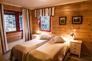 Postel nebo postele na pokoji v ubytování Lomakulkuri Apartments