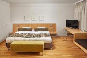 Łóżko lub łóżka w pokoju w obiekcie Reykjavik Natura - Berjaya Iceland Hotels