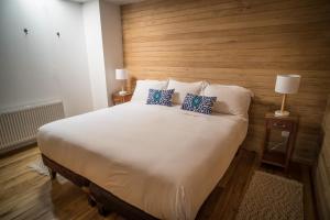 Postel nebo postele na pokoji v ubytování Palafito Loft