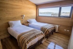 Postel nebo postele na pokoji v ubytování Palafito Loft
