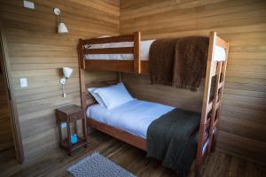 Postel nebo postele na pokoji v ubytování Palafito Loft